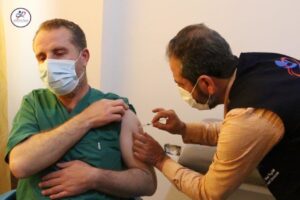 Idlib Health Directorate cadre receiving his vaccine