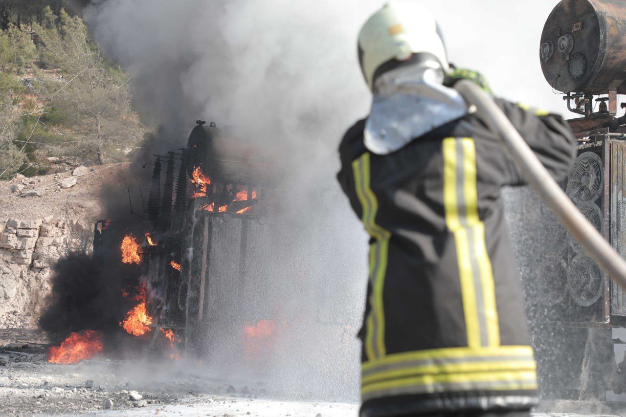 White Helmets putting out fire following Russian airstrike to power station.