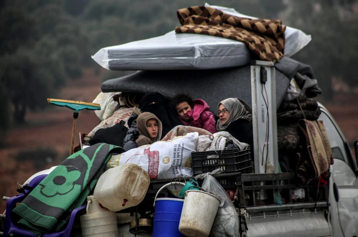 Syrian family fleeing Assad offensive.